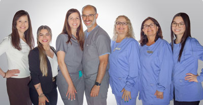 Dr.'s Hugo and Mirian Campos and their Cochituate Smile Center team