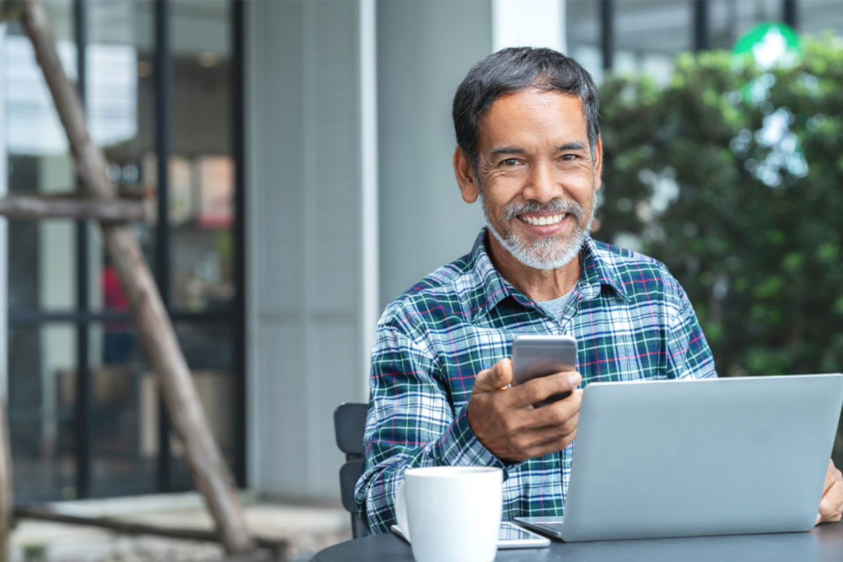 man scheduling a consultation for dental implants