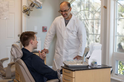 New patient speaking with the dental team in Framinham MA